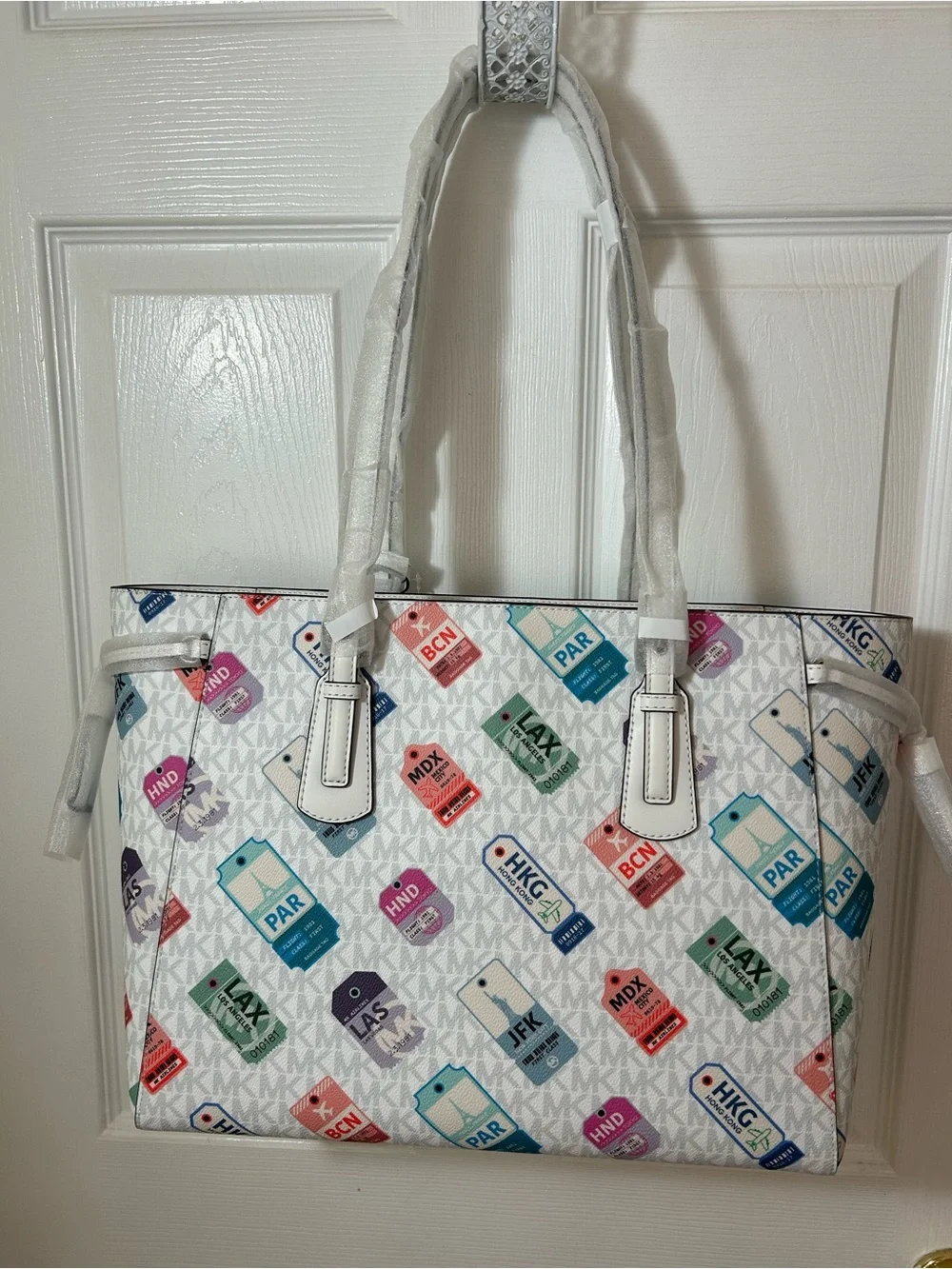 Michael Kors White Tote with Multicolor Luggage Tag Pattern